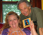 Frank presents first CD copy to Kelley Pettigrew